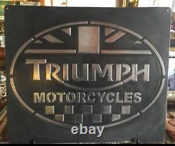 Triumph vintage cast metal sign