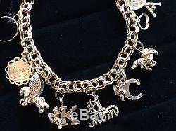 VINTAGE 14 k GOLD CHUNKY CHARM BRACELET ALL CHARMS ARE SIGNED 20 GRAMS