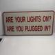 Vtg Sign Are Your Lights On Are You Plugged In Heavy Gauge Metal 24 X 12
