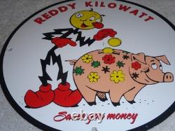 Vintage Reddy Kilowatt Piggy Bank Saves $$ 11 3/4 Porcelain Metal Gasoline Sign