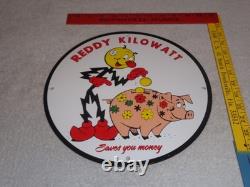 Vintage Reddy Kilowatt Piggy Bank Saves $$ 11 3/4 Porcelain Metal Gasoline Sign