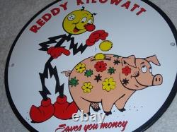 Vintage Reddy Kilowatt Piggy Bank Saves $$ 11 3/4 Porcelain Metal Gasoline Sign