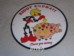Vintage Reddy Kilowatt Piggy Bank Saves $$ 11 3/4 Porcelain Metal Gasoline Sign