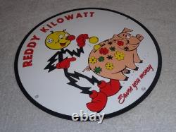 Vintage Reddy Kilowatt Piggy Bank Saves $$ 11 3/4 Porcelain Metal Gasoline Sign