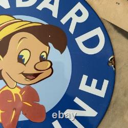 Vintage Standard Gasoline Pinocchio Walt Disney 12 Inch Porcelain Enamel Sign