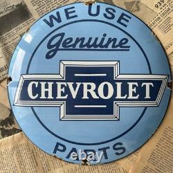 Vintage We Use Genuine Chevrolet Parts 12 Inch Convex Porcelain Enamel Sign