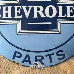 Vintage We Use Genuine Chevrolet Parts 12 Inch Convex Porcelain Enamel Sign
